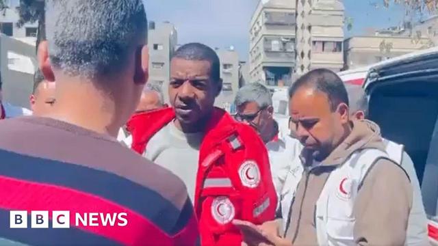 Screengrab of Palestine Red Crescent Society (PRCS) video showing paramedic Assad al-Nassasra (C) being greeted by colleagues in Gaza following his release by the Israeli military (29 April 2025)