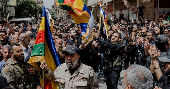 A funeral procession of killed Druse fighters after attacks by extremists on neighborhoods around the capital, Damascus, that are home to many Druse. A funeral procession of killed Druse fighters after attacks by extremists on neighborhoods around the capital, Damascus, that are home to many Druse.