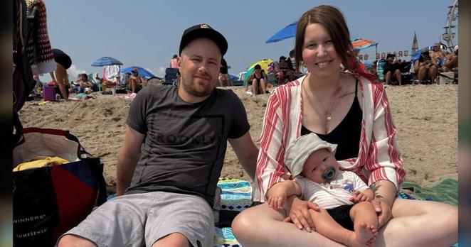 Valerie Buchanan, Chris Scheepers and their son in Old Orchard Beach, Maine in July 2024.