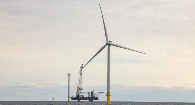 A wind turbine in the ocean.