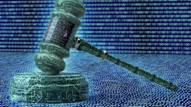 Illustration of a judge's gavel on a digital background resembling a computer circuit board.