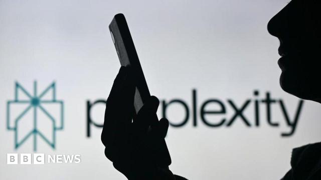 A silhoutted figure is shown holding their smartphone and looking at it in front of a white background displaying the Perplexity logo.