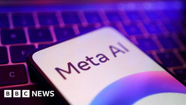 A phone showing the text "Meta AI" rests on a keyboard. The picture has pink and purple tones.