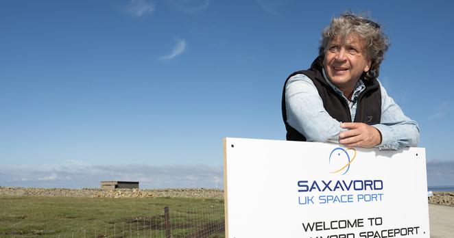 A person leans on a sign at SaxaVord UK Spaceport, which announces it as Europe's first licensed vertical launch facility, opened on May 29, 2024. A person leans on a sign at SaxaVord UK Spaceport, which announces it as Europe's first licensed vertical launch facility, opened on May 29, 2024.