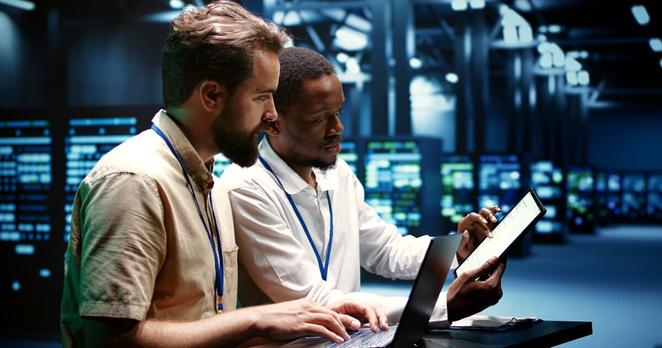Coworkers running data center tests