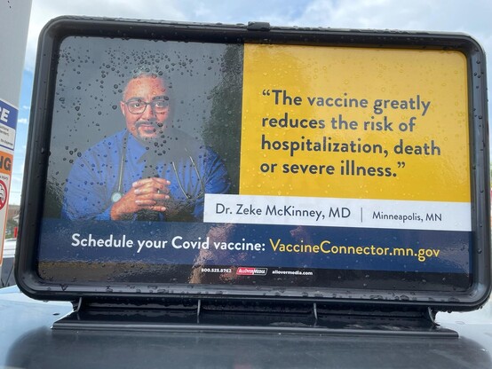 Gas station pump featuring Zeke McKinney with the quote, "The vaccine greatly reduces the risk of hospitalization, death, or severe illness."