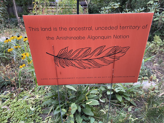 Sign: This land is the ancestral, unceded territory of the Anishnaabe Algonquin Nation. Land acknowledgement placed here in an act of reconciliation.