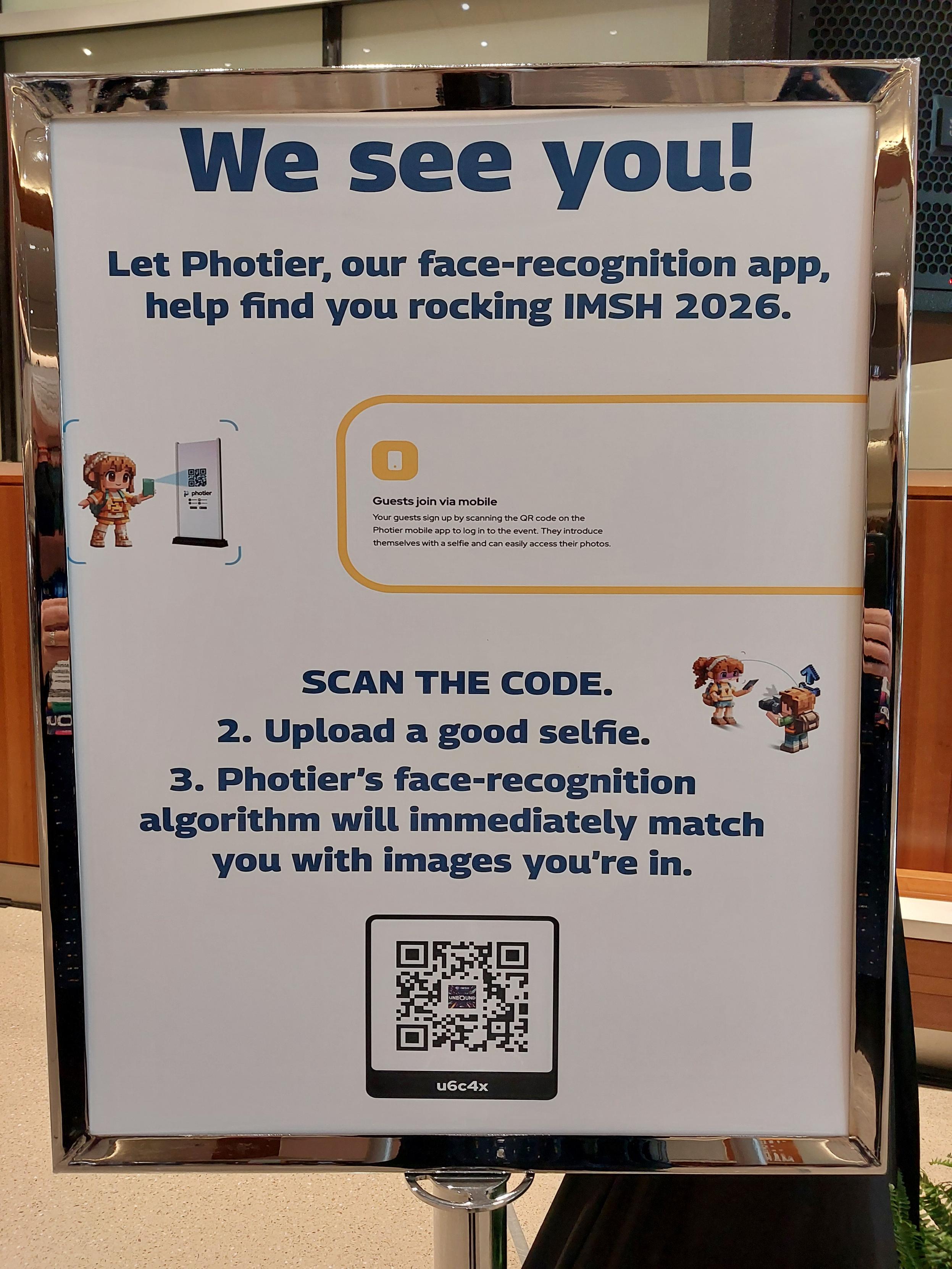 Sign at a conference inviting people to sign up for a face recognition app so they they can get forwarded all pics with their own face in them.