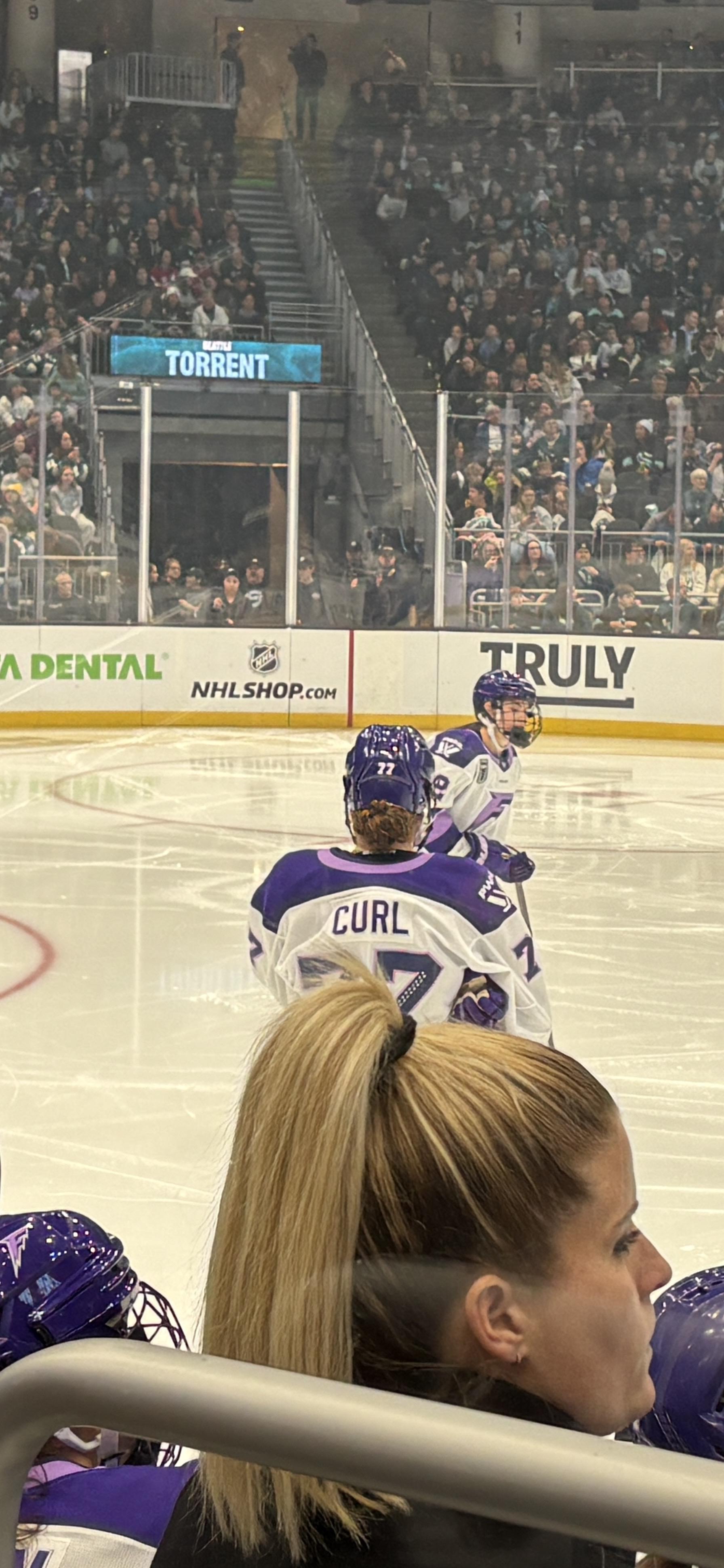Minnesota Frost player Curl on the ice against the seattle torrent.
