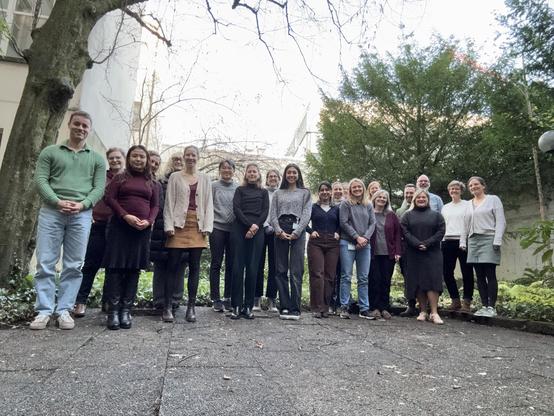 A bunch of friendly happy people smiling at the camera.