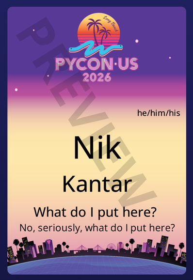 My PyCon US 2026 badge preview screenshot with my name and pronouns, and then the two custom lines as follows:
> What do I put here?
> No, seriously, what do I put here?