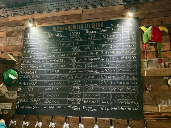 Photo of the pub beer list.  Chalk board showing 10 craft beers and 3 ciders. 