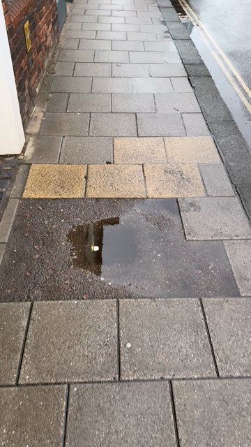 Video of a DPD delivery van parked on a pedestrian crossing. Driver returns to van and drives away. 
