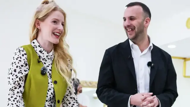 Hannah Spencer and Zack Polanski. Hannah is wearing a shirt and waistcoat combo. The shirt is white with a Dalmatian pattern.