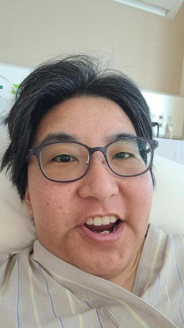 Me lying in a hospital bed