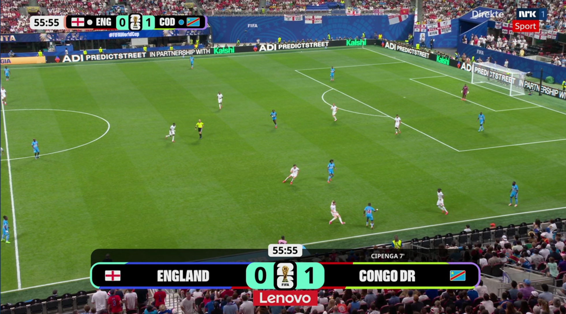 A screenshot of the football pitch on tv with the score on screen.