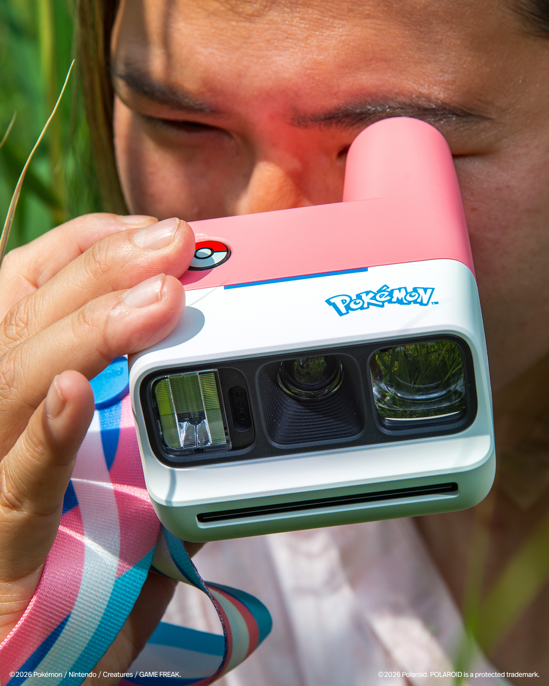 A Sylveon themed polaroid camera which is basically the trans pride colours; pink and white and blue. The pokeball is used as s shutter button.