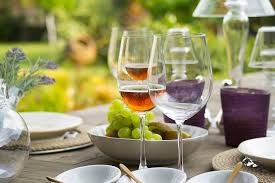 Glasses of wine on a table, outdoors.