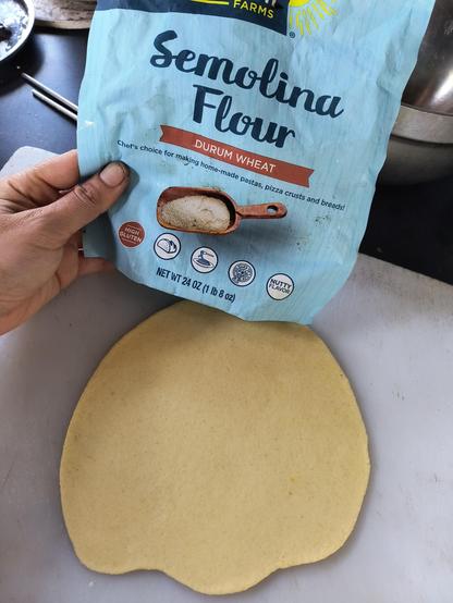 A package of semolina flour with a flattened semolina flour dough ready to be cut into pieces