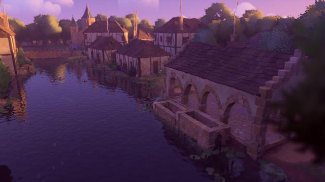 El mismo lavadero, pero desde el lado opuesto y al atardecer. De fondo se ve el típico poblado medieval de casas con tejados rústicos y una iglesia de piedra, y un puente también de piedra que cruza el rio, donde también hay patos. Cuac.