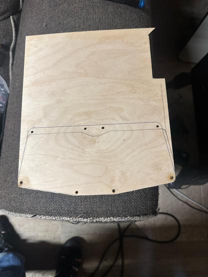 Same wooden plate, now with holes drilled in it in the appropriate place.