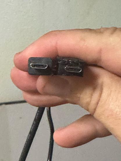 Two USB micro connectors, one having been shaved down to be thinner.