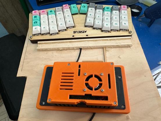 The same components, but with a groove cut in the bottom of the pie case and several wood strips glued down to hold things in position.