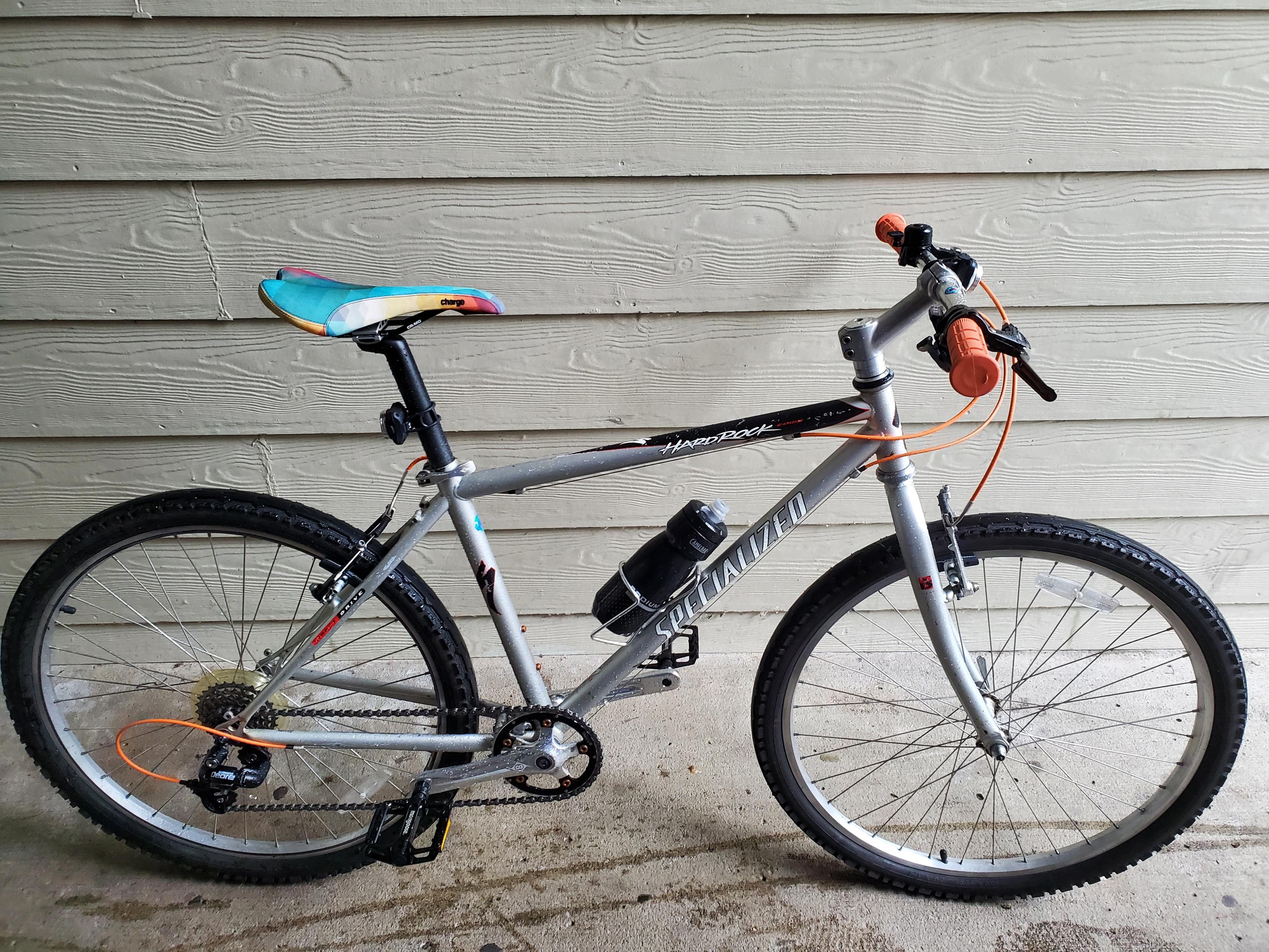 Rusty the HardRock, a silver black and orange Specialized mountain bike