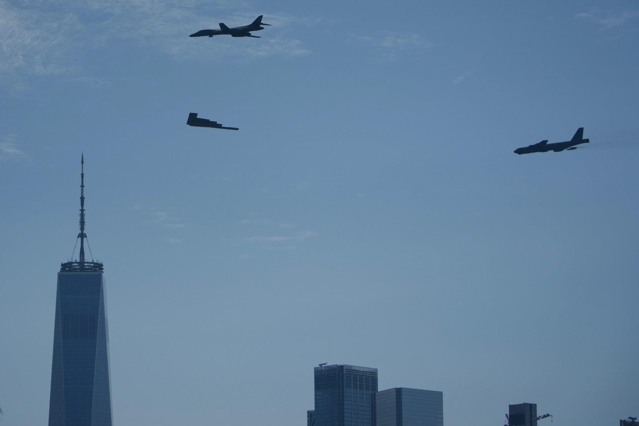 The B-1, B-2, and B-52 fly past the World Trade Center