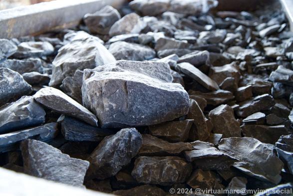 Closeup photo of stones inside a minecart.