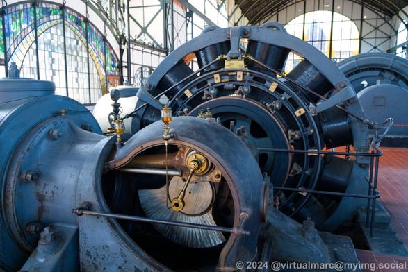 A detail photo of a generator inside the machine hall.