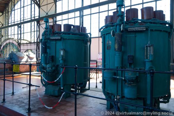 Tro big blue round machines (looking like transformers?) in the machine hall.