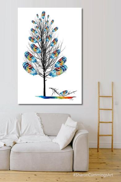 Colorful rainbow feather tree with a broken branch symbolizing resilience by artist Sharon Cummings.