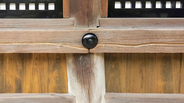 A scratch in the wood around the main hall of Kiyomizu-dera indicates where pilgrims held their rosary against the building during their 100+ times circling of the hall as a form of prayer.