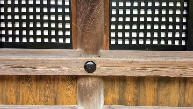 A scratch in the wood around the main hall of Kiyomizu-dera indicates where pilgrims held their rosary against the building during their 100+ times circling of the hall as a form of prayer.