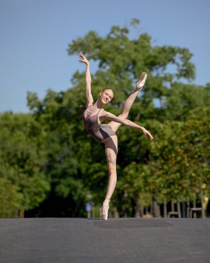 Ballerina Veronika Zhupakova captivates with her elegance and grace in this stunning summer street photoshoot. Dancing effortlessly against the backdrop of a sunlit cityscape, she blends the timeless beauty of ballet with the energy of urban life. Her flowing movements, poised on pointe, create a striking contrast against the modern architecture and bustling streets. Dressed in a delicate tutu, she embodies the art of dance, transforming everyday surroundings into a stage. The warm summer light enhances the beauty of each pose, highlighting her strength, precision, and passion for ballet. This photoshoot captures not only the skill and dedication of a professional ballerina but also the harmony between classical art and contemporary city life. A perfect fusion of movement, elegance, and the vibrant spirit of summer.