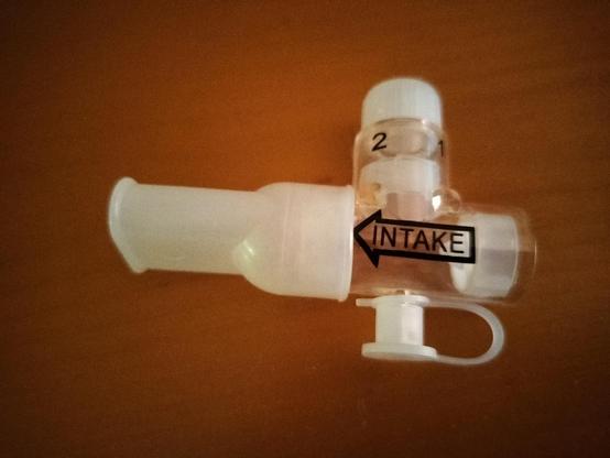 A plastic pep device with the text intake