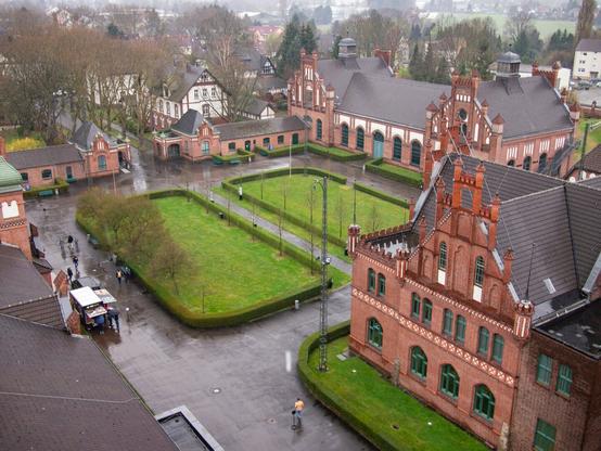 Color photo of the courtyard and some administrative buildings of Zollern colliery in Dortmund.