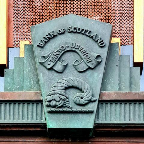 An Art Deco style bank emblem on a 1930s Glasgow building.