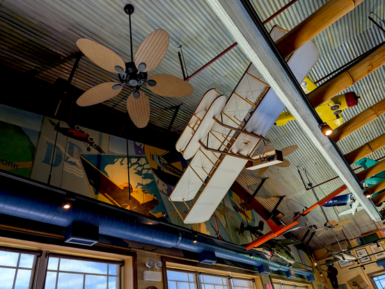Ceiling at Pilot Pete's restaurant. There are murals depicting aviation and model aircraft strewn up