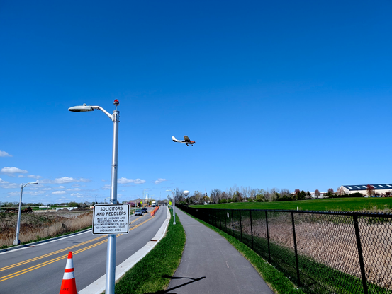 Aircraft landing at Schaumburg. The street lights are small with red beacons on top for the aircraft landing to not hit them.