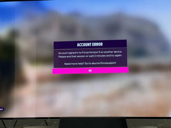 Screenshot of an error saying “Account signed in to Forza Horizon 5 on another device. Please end that session or wait 2 minutes and try again “