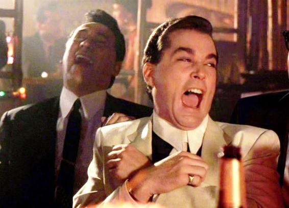 Ray Liotta, portraying Henry Hill, in the laughing scene from the film 'Goodfellas.'