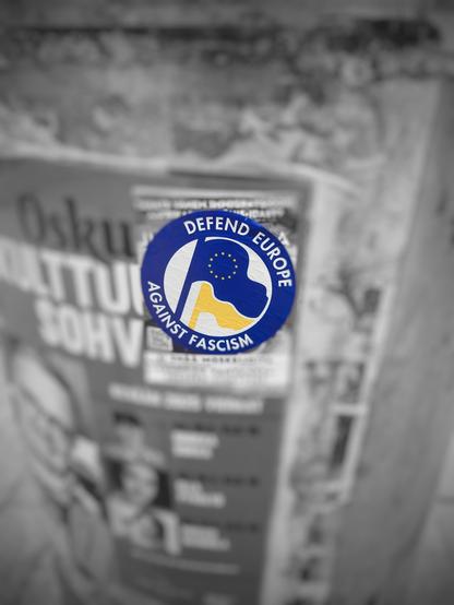 Sticker on a pole saying: defend Europe against fascism