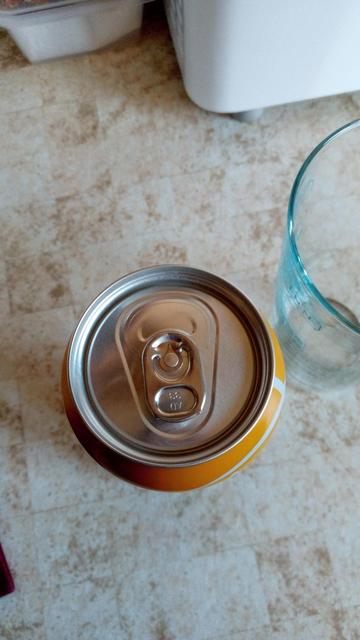 The very top of a can of Boddingtons beer which I was about to drink. The ring pull is upside down for use and it looks like a robot head with a visor and an open mouth.

... Or maybe I just have a vivid imagination! 😄