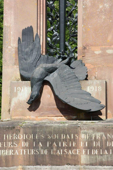 a  close-up  of the eagle , gold lettering in stone underneath it