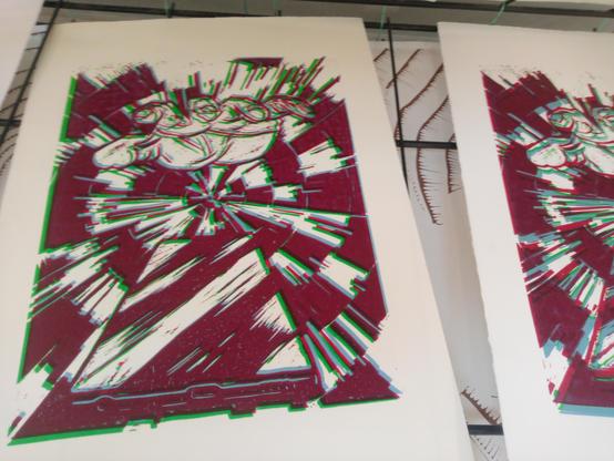 Pages with print of hand reaching for phone on radial background, colors are severely misaligned for eye-hurting effect