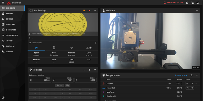 Screenshot of the Mainsail Web Interface for 3D-Printers. It has a webcam view of the printer and some stats on the model and temperature etc. The model seems to be a round coaster with starfleet logo.