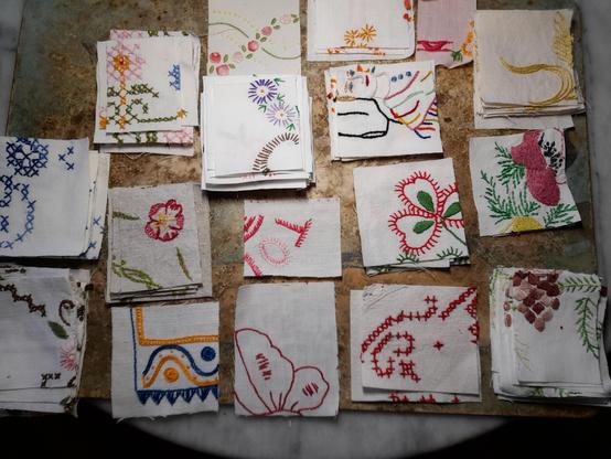 A collection of small scraps of embroidered fabric. Someone has randomly cut the fabric, often through motives or patterns. I sorted different images by the colour of the yarns and the style but it's impossible to puzzle the whole project. Even after this destruction, the remains are beautiful for collage art.