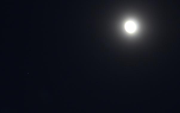 The Moon at waxing gibbous phase at upper right. Star dot Spica at lower left side edge.